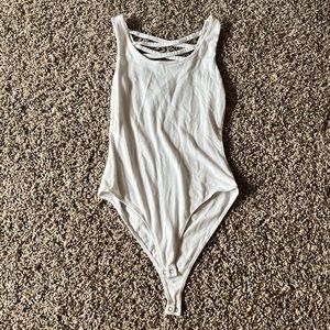 Charlotte Russe white bodysuit with criss-cross back size S